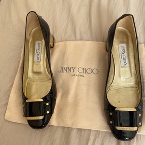 Adorable black patent leather Jimmy Choo shoes.